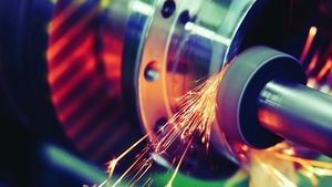 Finishing metal working on high precision grinding machine in workshop