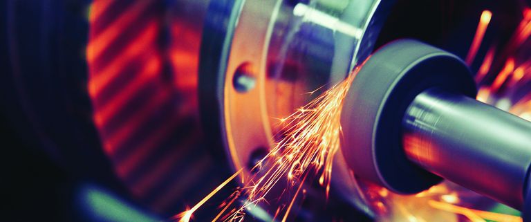 Finishing metal working on high precision grinding machine in workshop